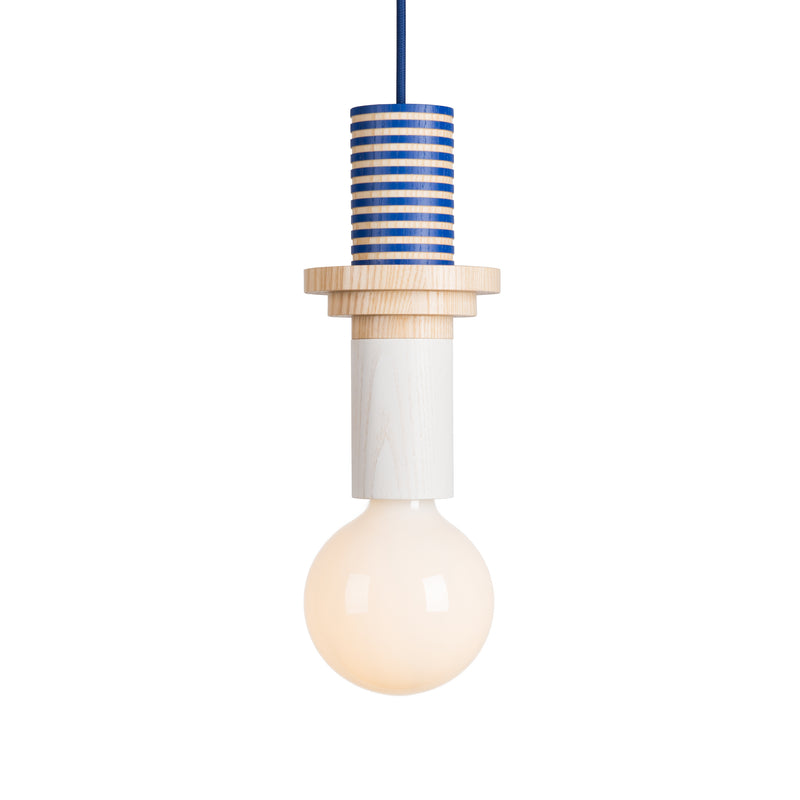 The Junit Column by Schneid is a modern pendant lamp with a round bulb and sleek ash wood fixture. It features a contemporary blue and natural wood striped pattern on top, suspended by a blue cord.