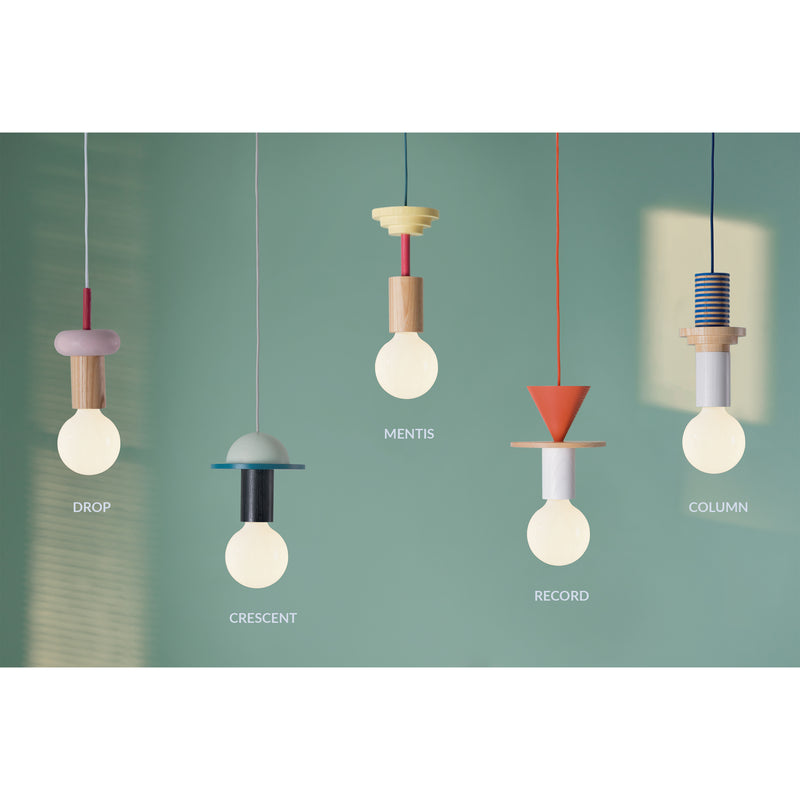 Five pendant lights by Schneid, crafted from ash wood, hang against a teal backdrop. Each has unique geometric designs and names: Drop, Crescent, Mentis, Junit Record, and Column. These modular lamps feature shapes like spheres, cones, and cylinders in various colors for ambient lighting.