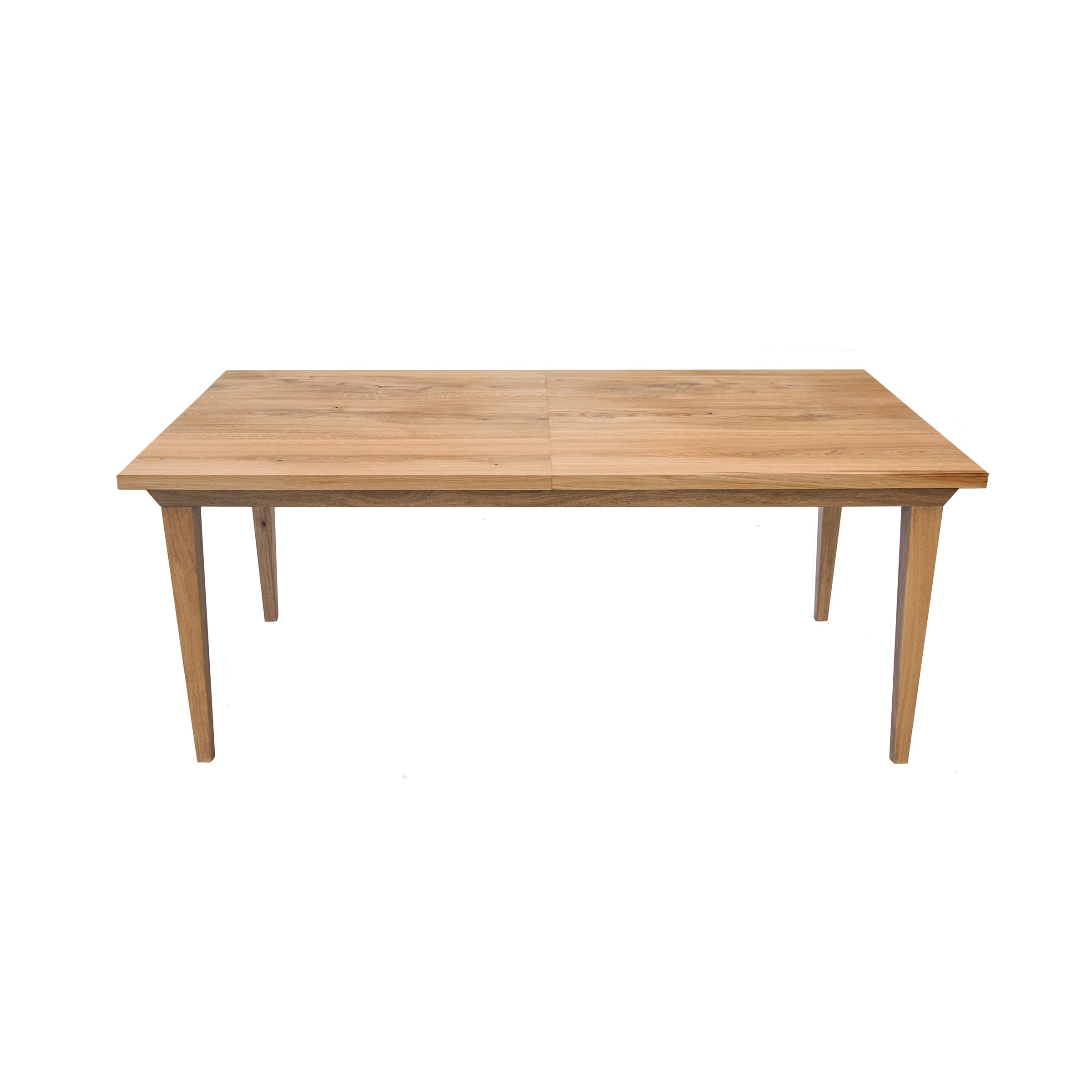 The Join Extendable Table by One For Hundred is a rectangular, light brown, solid wood dining table. It features an extendable design with four straight legs and a smooth surface, presented against a plain white background.