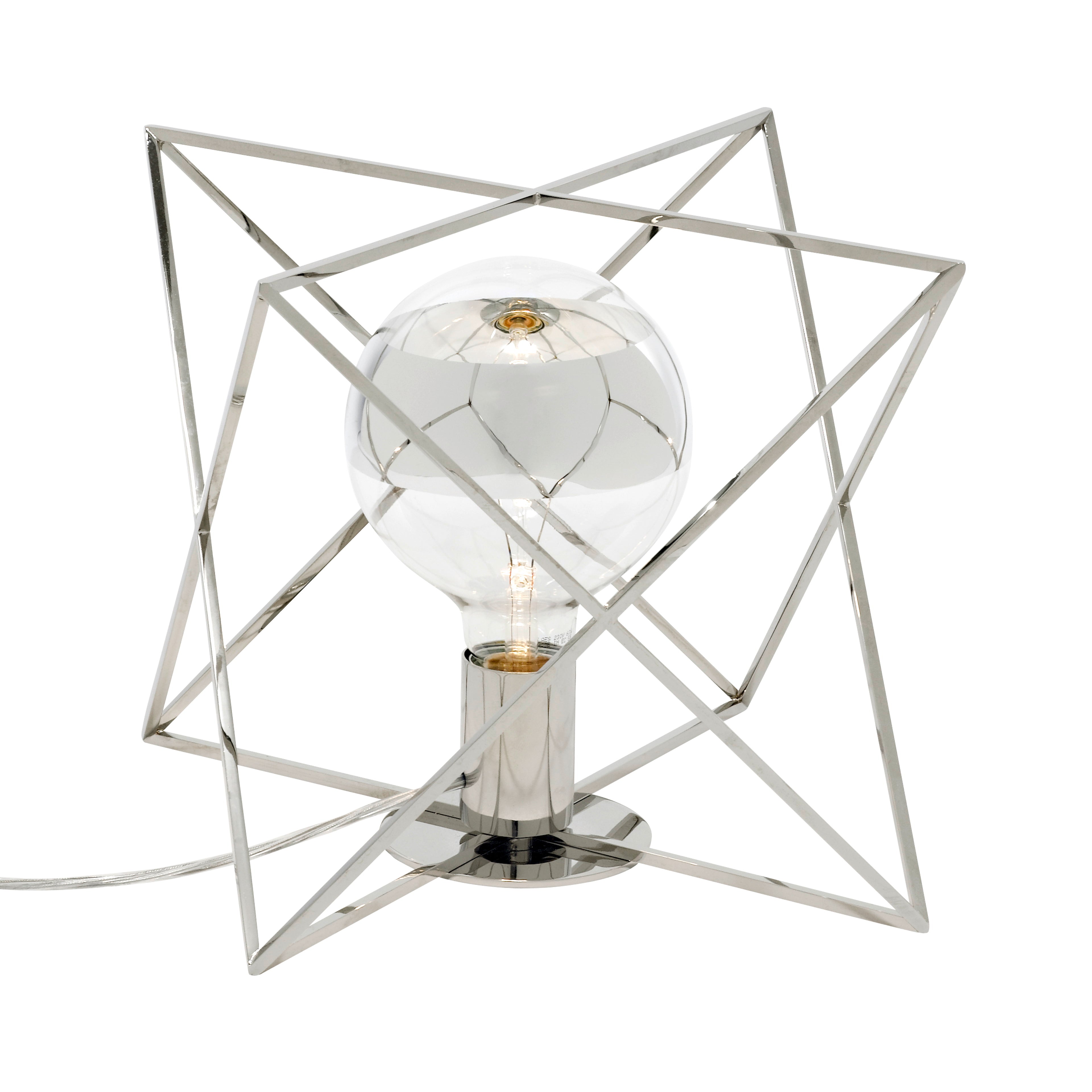 The LUM Table Lamp by KAIA features geometric perfection with a star-shaped solid brass frame and a visible round bulb at its center. The silver metallic finish adds elegance, making it a stylish addition to any space.