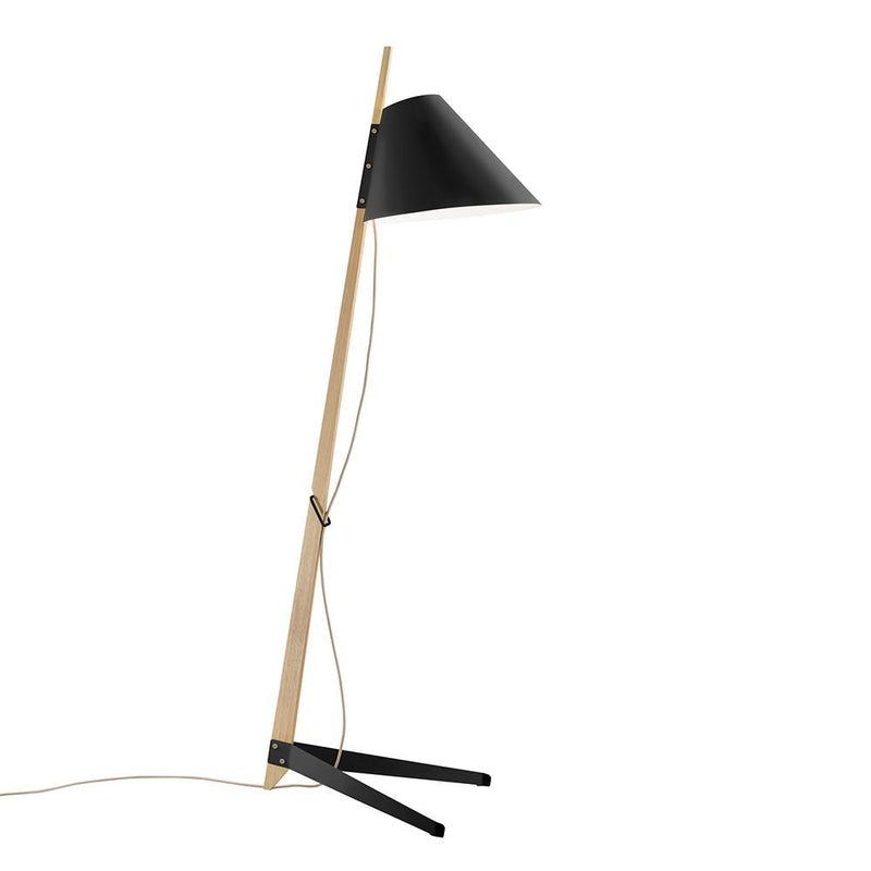 Discover the elegance of the Billy Floor Lamp by Kalmar, featuring a wooden frame and sleek black conical shade. Its minimalist design boasts a lacquered metal base and cord, artistically leaning to deliver an effortlessly contemporary style reminiscent of Kalmar Werkstaettens aesthetics.