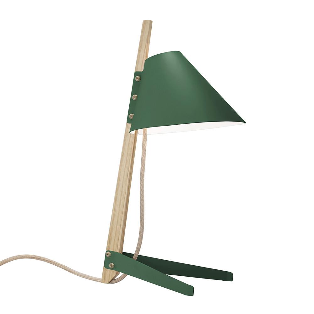 The Billy Table Lamp by Kalmar boasts an industrial design with a green lacquered metal shade on an incline. It features a light wood stand and base, plus a fabric-covered cord, offering a sleek, minimalist aesthetic.