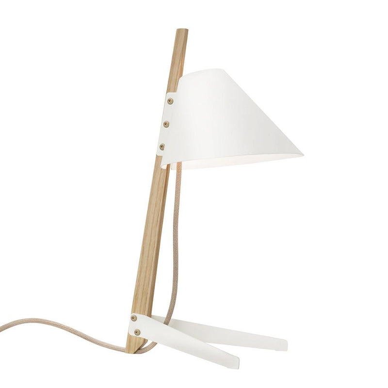 The Billy Table Lamp by Kalmar is a modern piece featuring a wooden stand and white conical shade with an industrial touch. It has a beige power cord, blending natural and contemporary styles with its minimalist design.
