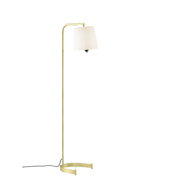 The Egon Floor Lamp by Kalmar features a sleek brass design, a natural silk shade on a slightly bent arm, and an elegant black cord against the white base. Its pivoting shade adds versatility to this modern piece.
