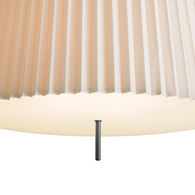 The Kalmar Fliegenbein HL Pendant features a close-up of a white pleated silk shade with a translucent look, allowing soft light diffusion. A small horizontal metal rod beneath the shade is visible, against a plain white background.
