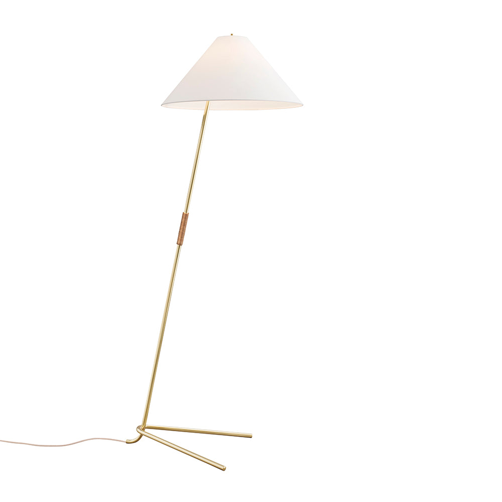 The Hase Floor Lamp by Kalmar is a minimalist piece featuring a sleek, angled brass stand and a white conical fabric shade inspired by Wiener Werkbund. It has a slender polished brass tripod base with the power cord extending against a plain white background.