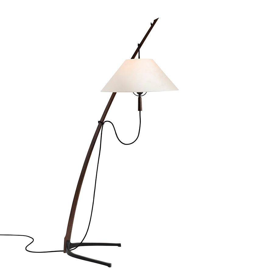 The Dornstab Floor by Kalmar is a minimalist freestanding luminaire with a slender, curved stand and white conical shade. Its elegant design is completed by a black base and cord, echoing the timeless style of the Wiener Werkbund.