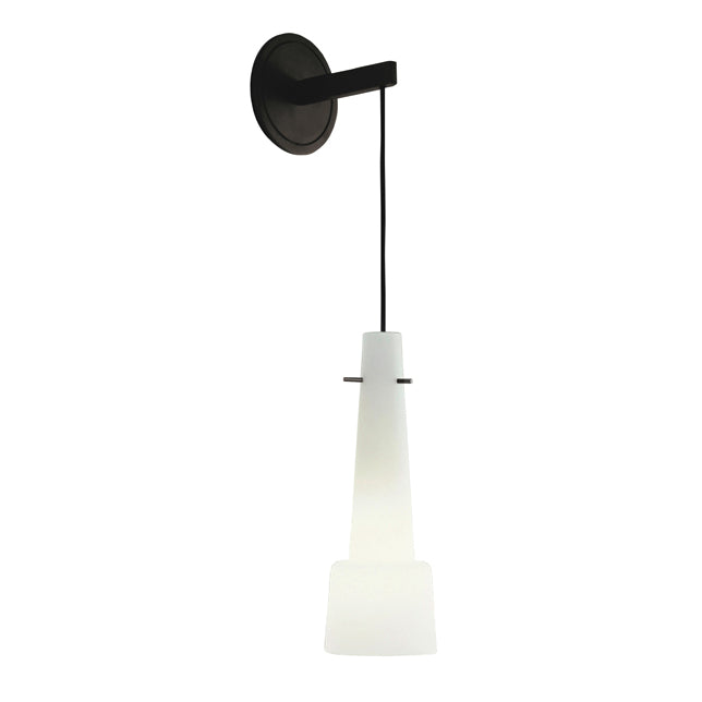 The Keule Wall by Kalmar is a contemporary wall-mounted pendant light with a black bronze circular base and arm. It has a sleek black cable suspending a conical, frosted white glass shade that provides a soft glow.
