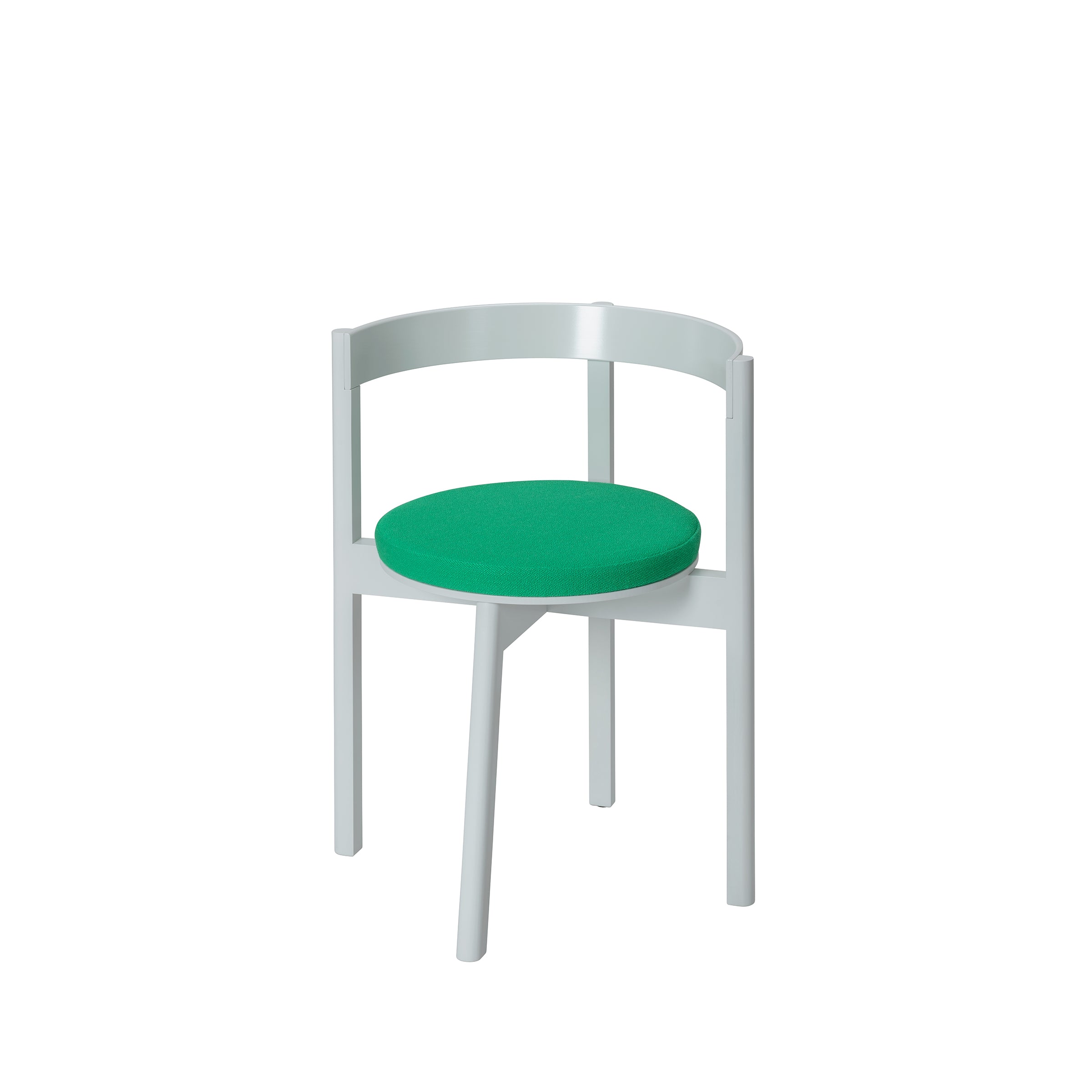 Introducing the L5 JAZZ Armchair by Loehr: a chic dining chair with a light gray frame and round green seat. It features a minimalist curved backrest, four angled solid wood legs, clean lines, and offers a contemporary look against its plain white background.
