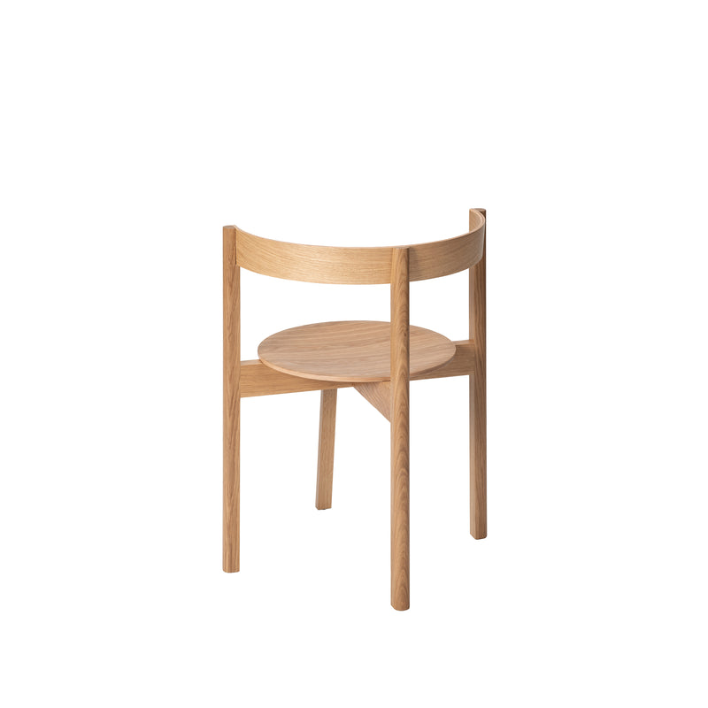 Introducing the L5 JAZZ Armchair by Loehr: a modern wooden design with minimalist elegance, featuring a round seat, curved backrest, and three sturdy legs. Its solid wood construction showcases natural grain against a plain white backdrop.