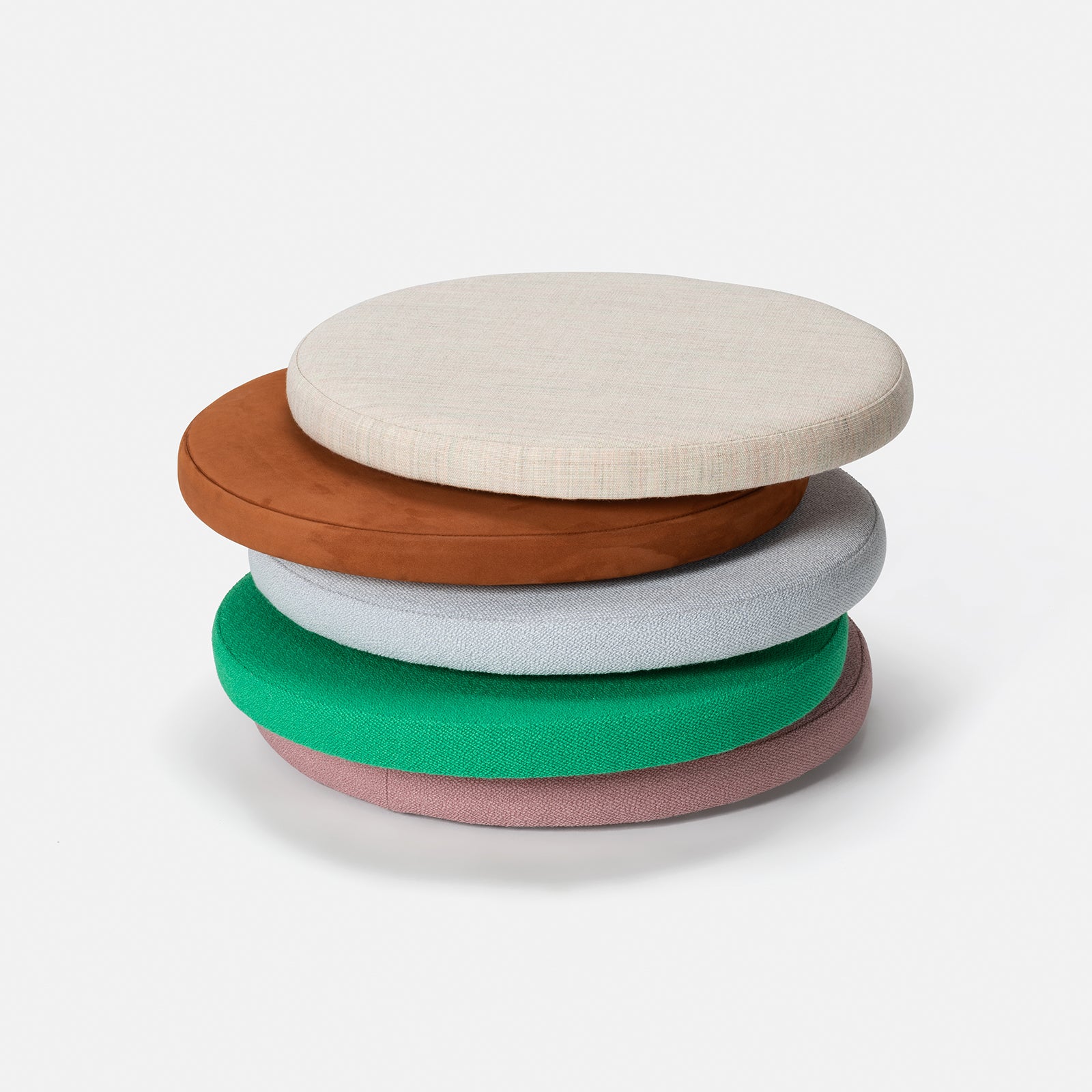Five round, flat cushions in beige, brown, gray, green, and pink sit elegantly on a white background. Perfect for pairing with a Loehr L5 JAZZ Armchair or enhancing the comfort of your solid wood dining chair.