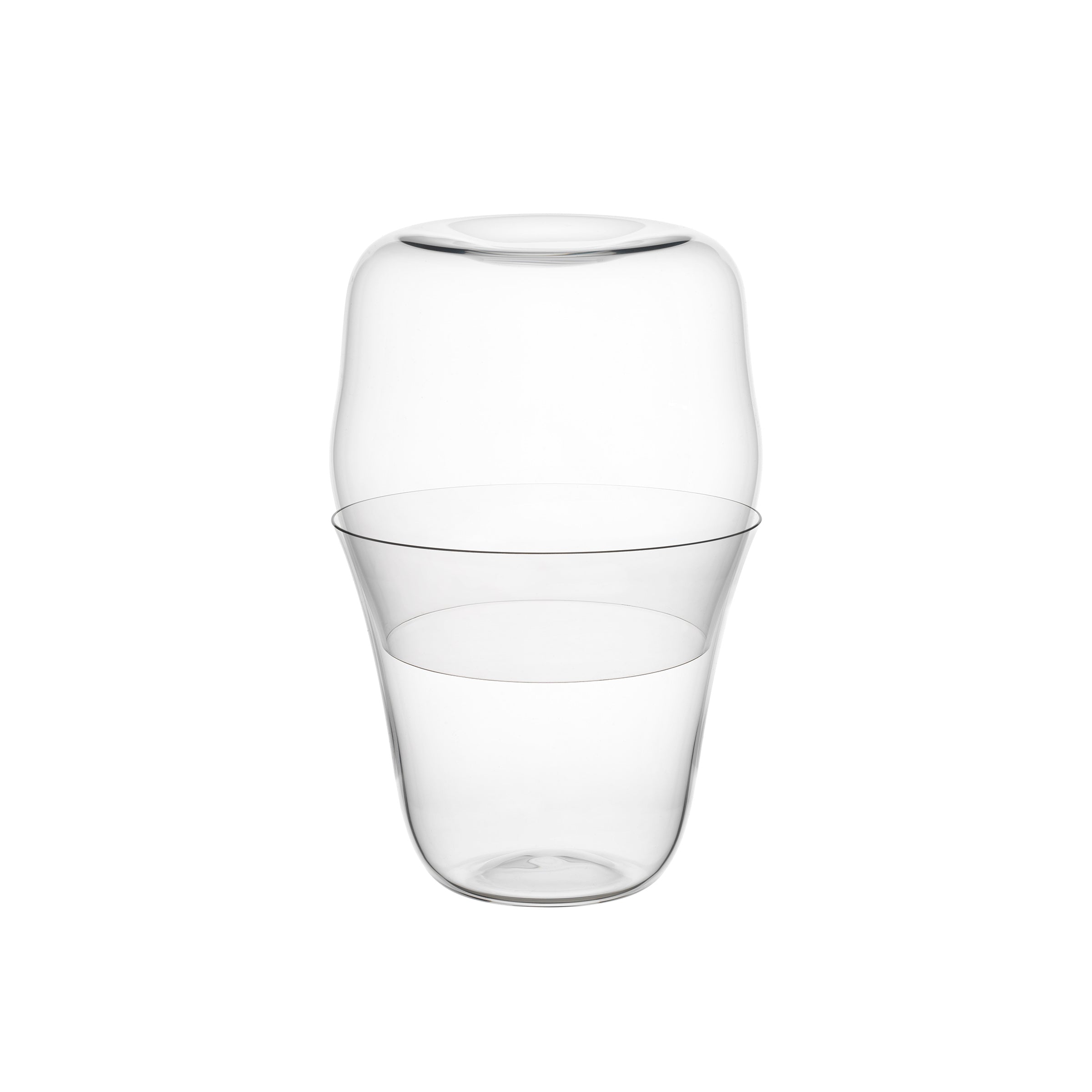 The Reigen Tumbler by Lobmeyr features sleek, modern glass design reminiscent of Aldo Bakker. With two seamlessly stacked sections, the wider top tapers elegantly into a narrower base, showcasing a minimalist style akin to premium stacking glassware.
