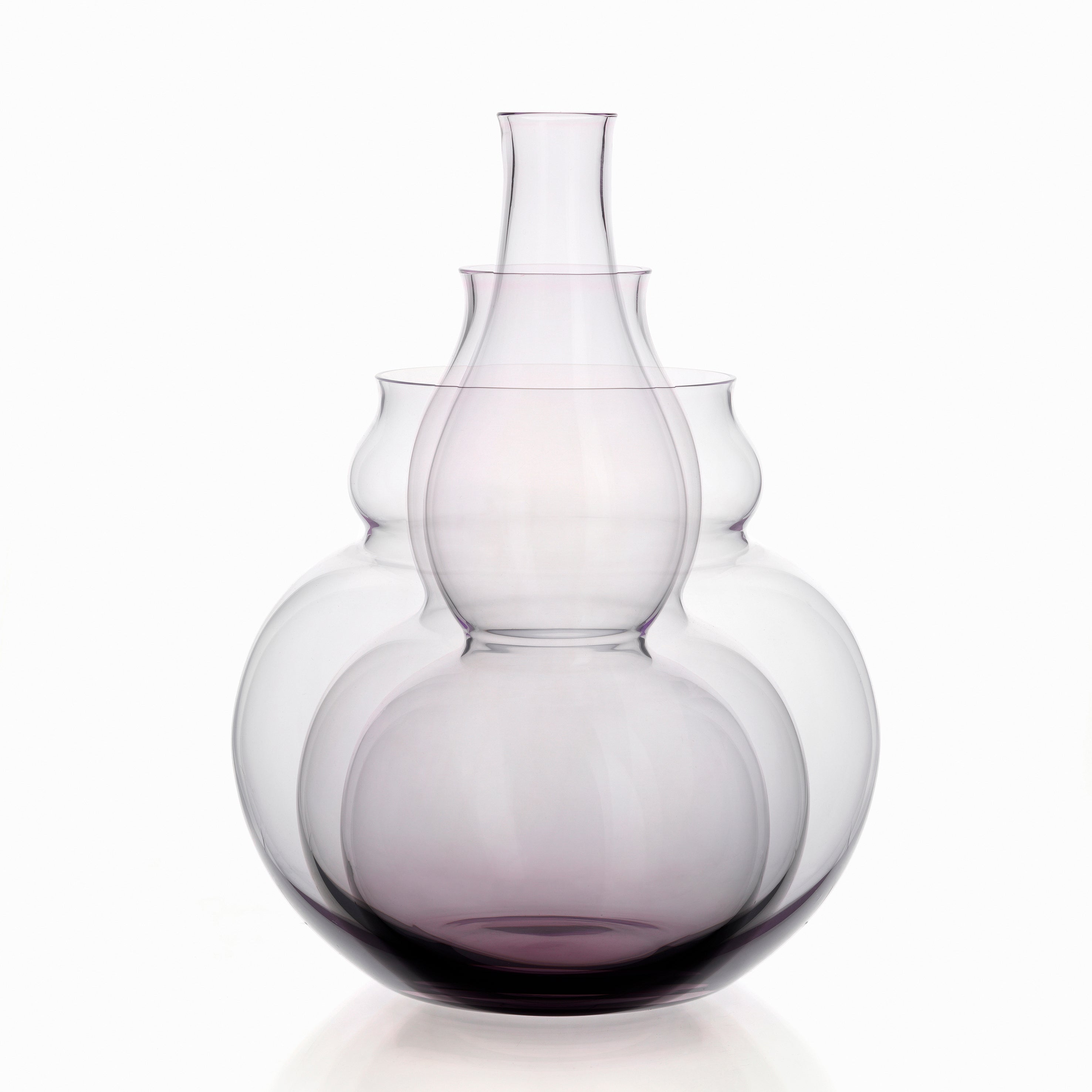 The BV71 Calabash Flower Vase by Lobmeyr is a minimalist sculpture in a bulbous, layered design like a calabash, crafted from mouth-blown lead-free crystal with a subtle purple tint, standing elegantly on a plain white background.