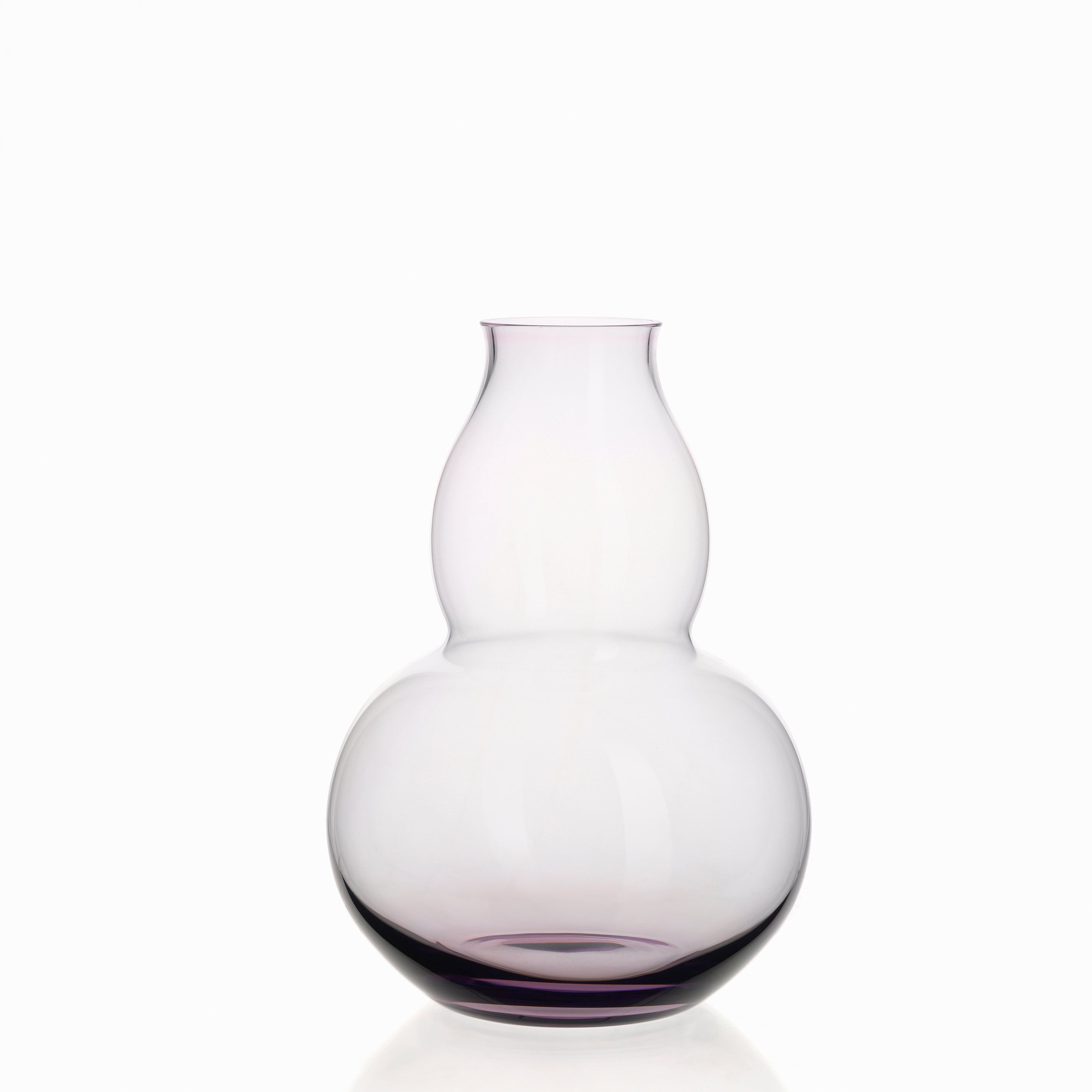 The BV71 Calabash Flower Vase by Lobmeyr features a clear double-bulbous design like a calabash gourd, widening at the base and narrowing to a smaller round top. Mouth-blown from lead-free crystal with a subtle purple hue, its elegantly set against a plain white background.