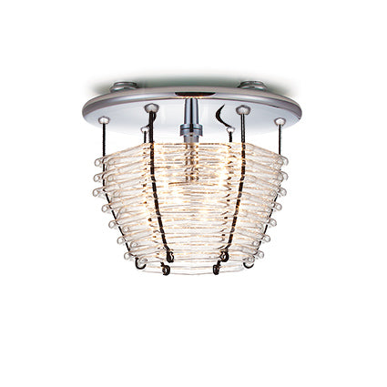 The Basket Ceiling by Lobmeyr is a modern ceiling light with a circular design featuring mouth-blown crystal rods in a conical shape encasing the light bulb, offering a stylish and elegant look.