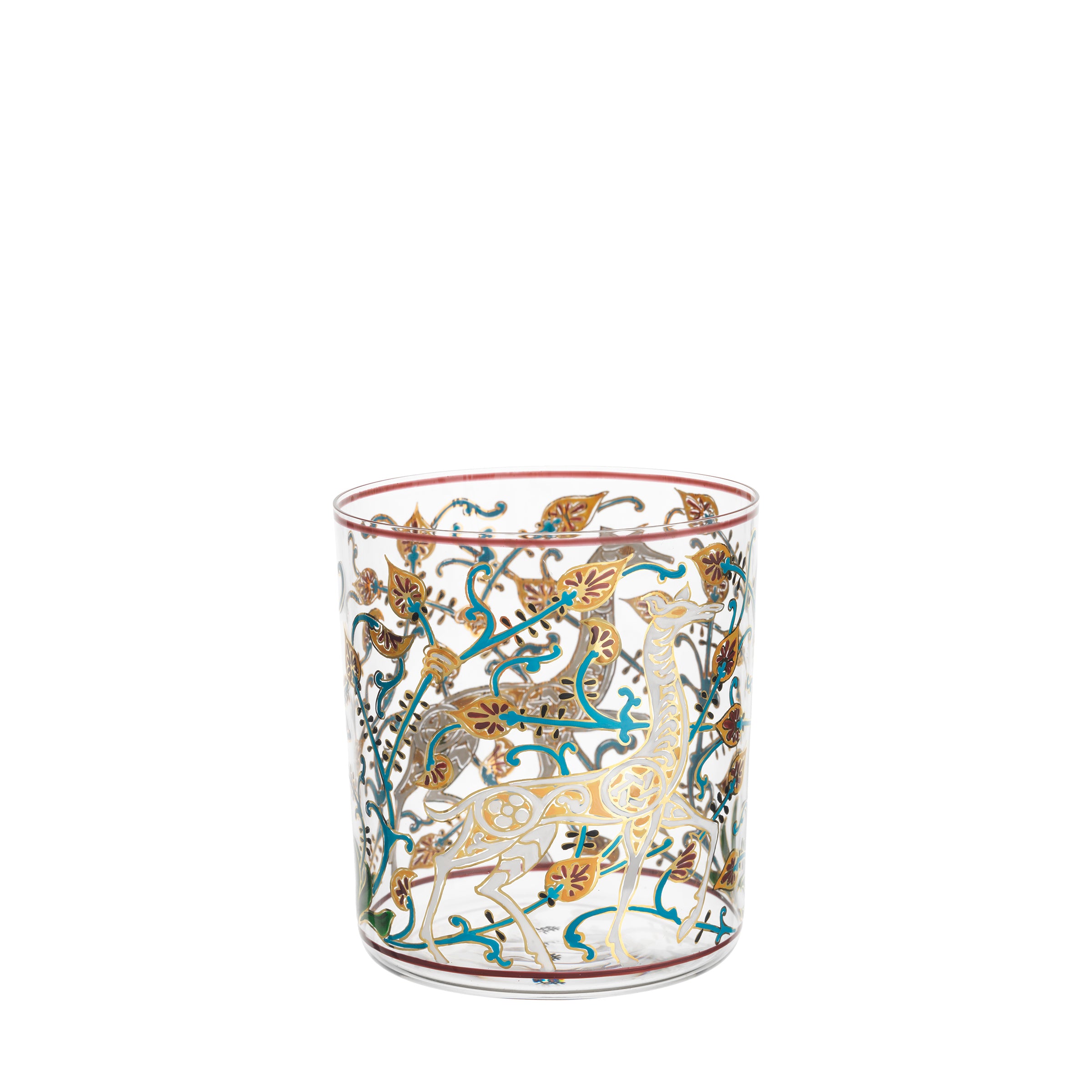 The Alhambra DOF Tumbler by Lobmeyr showcases exquisite gold patterns, colorful leaves, and animals like deer on clear glass. Accented with vibrant teal and amber, it echoes the elegant charm of the Alhambra Palace, each piece a hand-painted crystal masterpiece in the Lobmeyr collection.