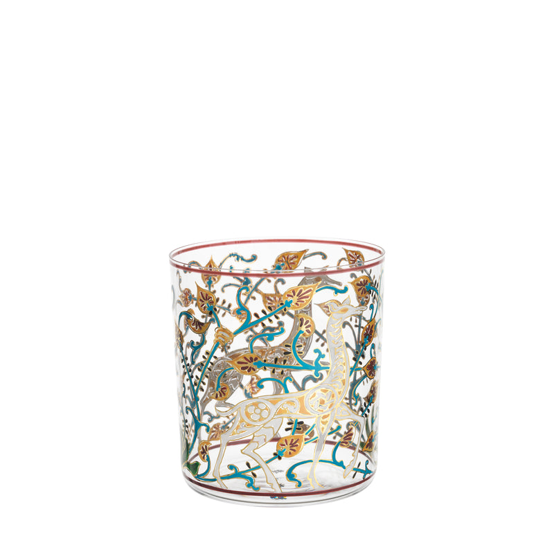 The Alhambra DOF Tumbler by Lobmeyr showcases exquisite gold patterns, colorful leaves, and animals like deer on clear glass. Accented with vibrant teal and amber, it echoes the elegant charm of the Alhambra Palace, each piece a hand-painted crystal masterpiece in the Lobmeyr collection.