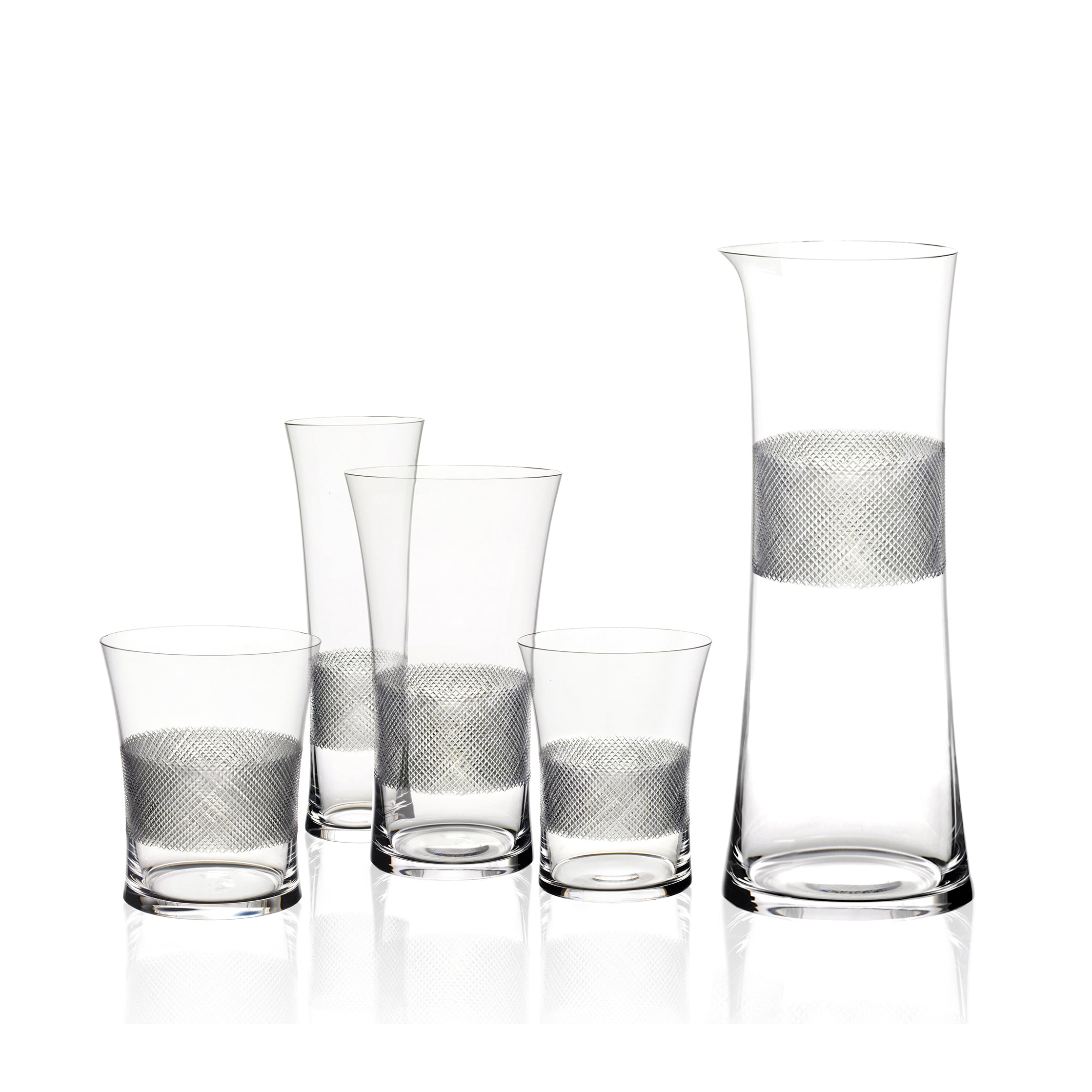 The Drinking Set No. 282 - Diamond Cut by Lobmeyr includes a tall carafe and four glasses, each embellished with a textured silver band in Ted Muehlings style, arranged from shortest to tallest against a plain white background.