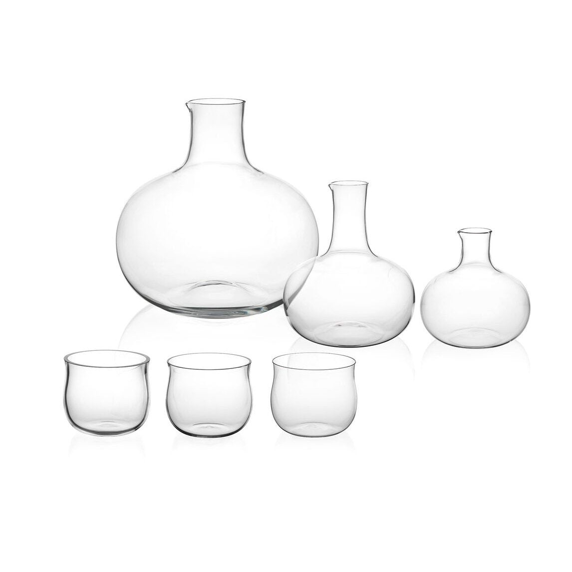 The Lobmeyr Drinking Set No. 286 - Normal-Special is a clear, mouth-blown lead-free crystal collection featuring three carafes with round bases and narrow necks, complemented by short, rounded glasses. This elegant set embodies timeless charm.