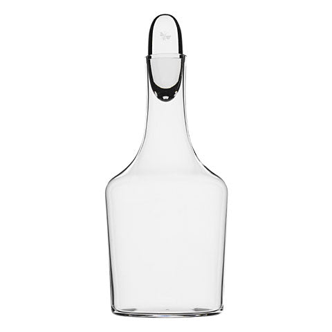 The Lobmeyr Drinking Set No. 257 - Commodore features a tall, clear bottle with mouth-blown lead-free crystal, narrow neck, wide base, and an elegant flat-topped stopper. Part of the Oswald Haerdtl series, it exudes timeless sophistication against a white background.