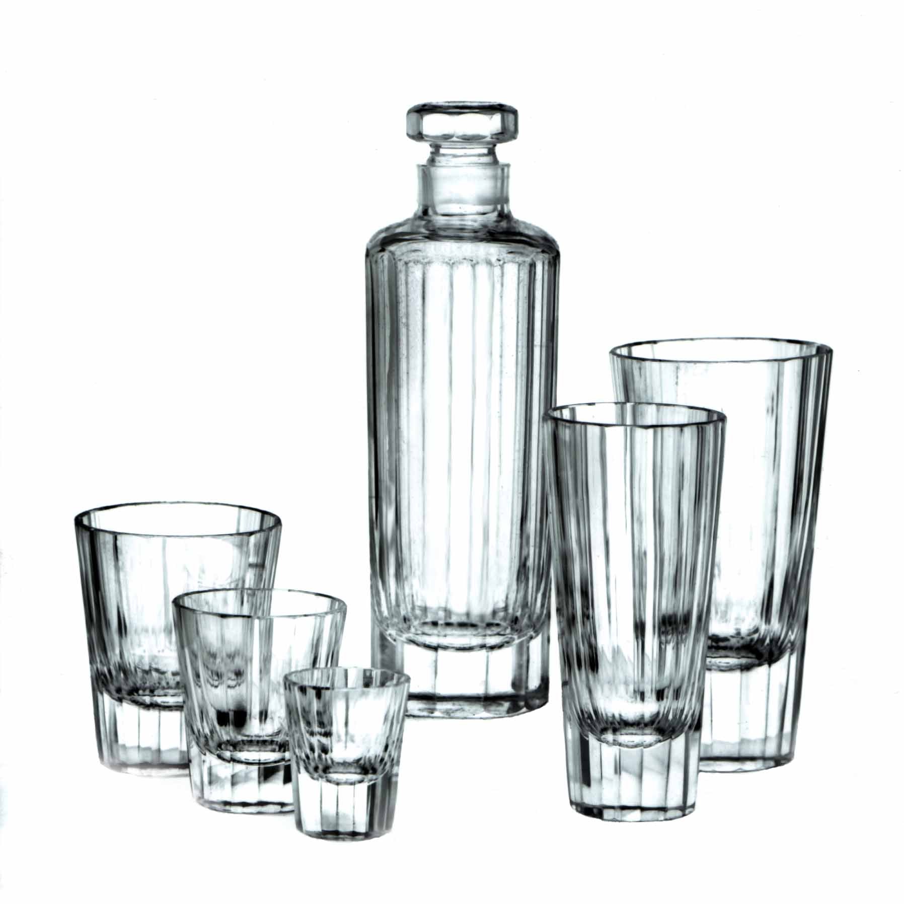 The Lobmeyr Drinking Set No. 272 - Triennale features a tall decanter with stopper, two tall glasses, two medium tumblers, and a small shot glass, all crafted from lead-free crystal and beautifully arranged on a white background.