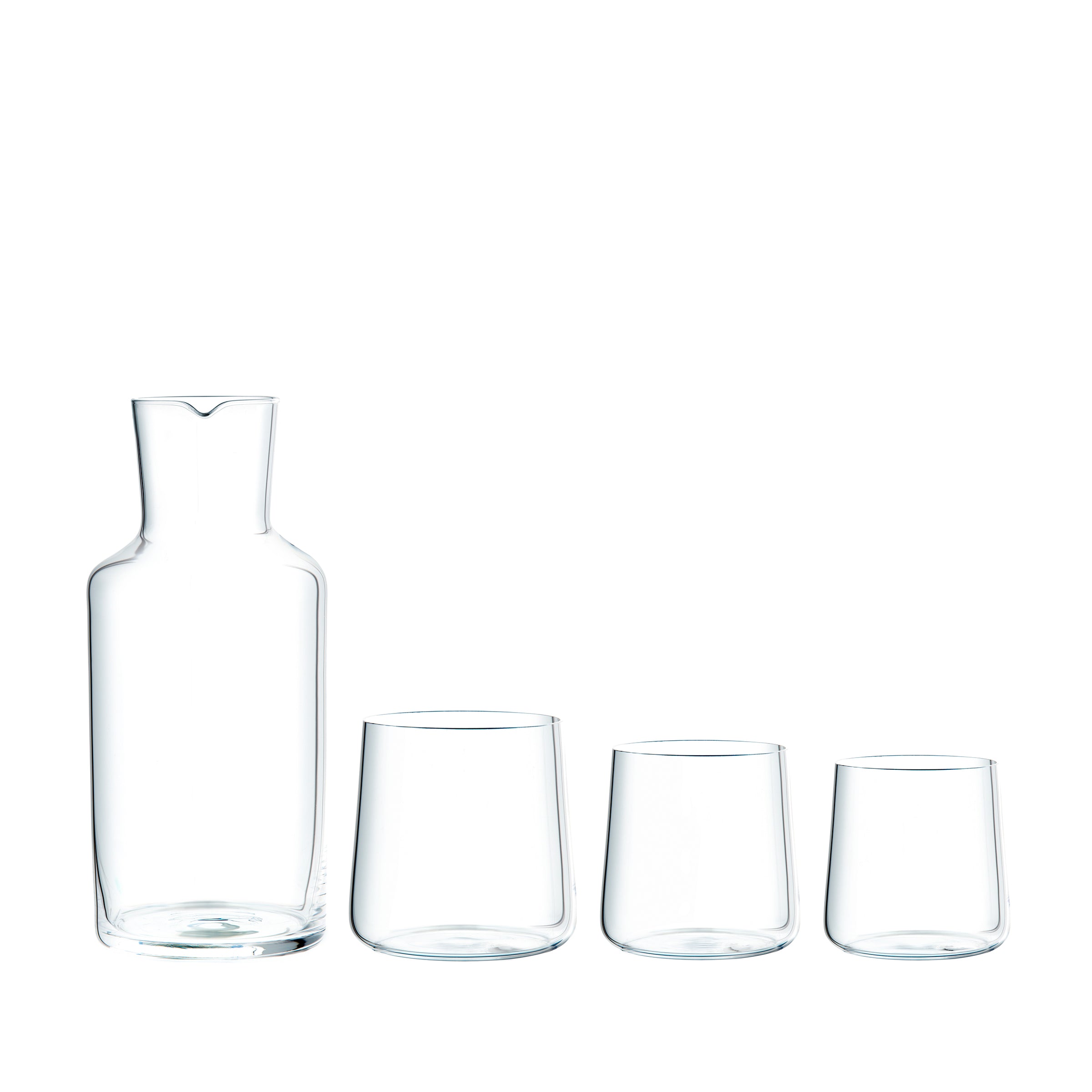 The Lobmeyr Drinking Set No. 283 Fortune Clear features a clear glass carafe and three differently sized tumblers made from mouth-blown crystal, set against a plain white background to highlight the minimalist elegance typical of Mark Brauns design.