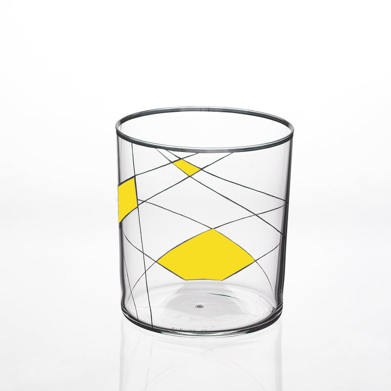 The Neo Light X from Lobmeyr is a clear glass tumbler showcasing a geometric design with curved black lines and bold yellow diamonds. Its plain white background highlights the modern artistic pattern, reminiscent of Martino Gampers style.