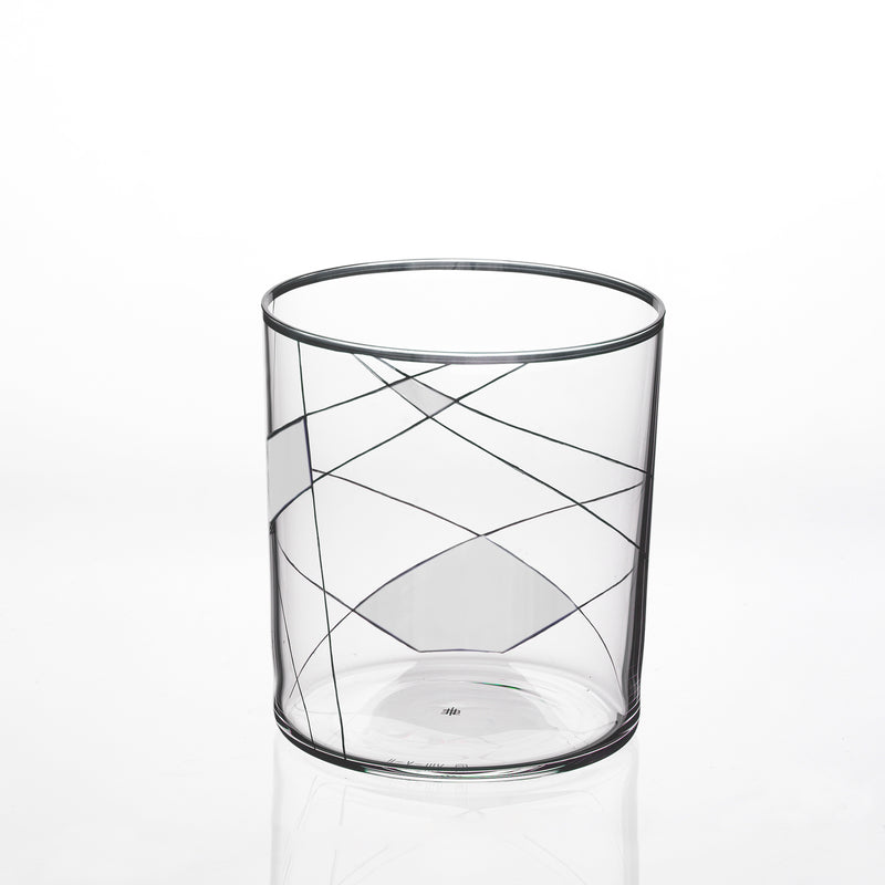 The Neo Light X by Lobmeyr is a clear glass tumbler adorned with abstract black swirling lines on a white background, showcasing Martino Gampers flair for modern ornamentation.
