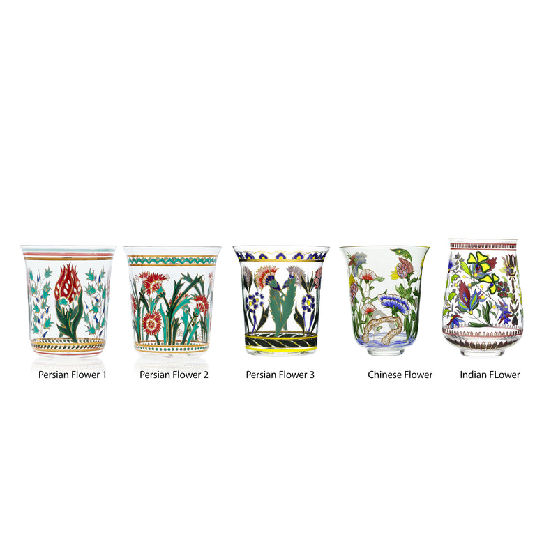Five Lobmeyr Oriental Flower Tumbler vases showcase distinct, decorative floral designs: from left to right, Persian Flower 1 (red flowers), Persian Flower 2 (various red blooms), Persian Flower 3 (intricate patterns), Chinese Flower (blue and red flowers), and Indian Flower (yellow hues).