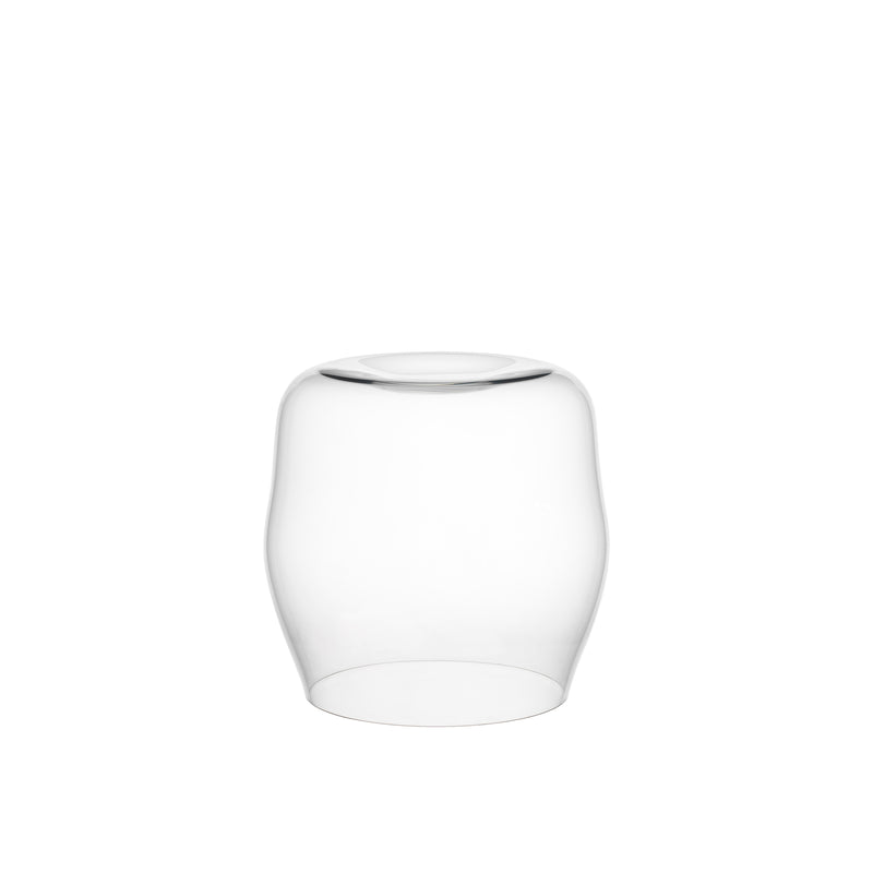 The transparent glass vase has a rounded, slightly tapered design reminiscent of an Aldo Bakker creation. Set against a white background, its smooth surface and subtle shine echo the minimalist elegance of the Lobmeyr Reigen Tumbler.