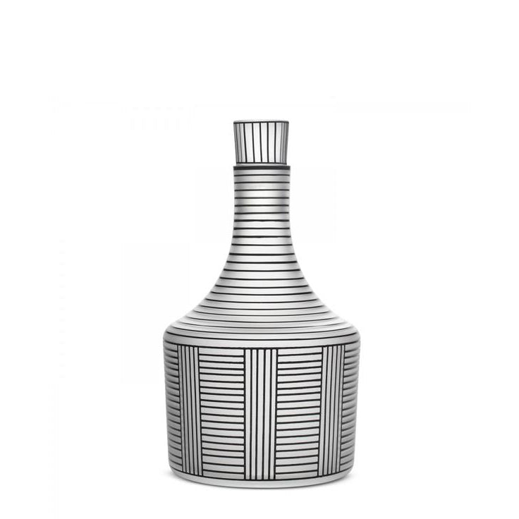 The Drinking Set Serie B by Lobmeyr features a ceramic vase with black vertical and horizontal lines in a geometric pattern on a white background, reminiscent of Josef Hoffmanns style, with a narrow neck and wider base.