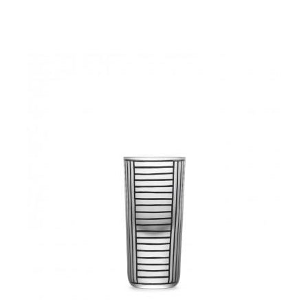 The Drinking Set Serie B by Lobmeyr features a tall, transparent glass with vertical black stripes and horizontal white bands forming a grid pattern reminiscent of Josef Hoffmanns design, exuding elegance. Its beautifully centered on a plain white background.