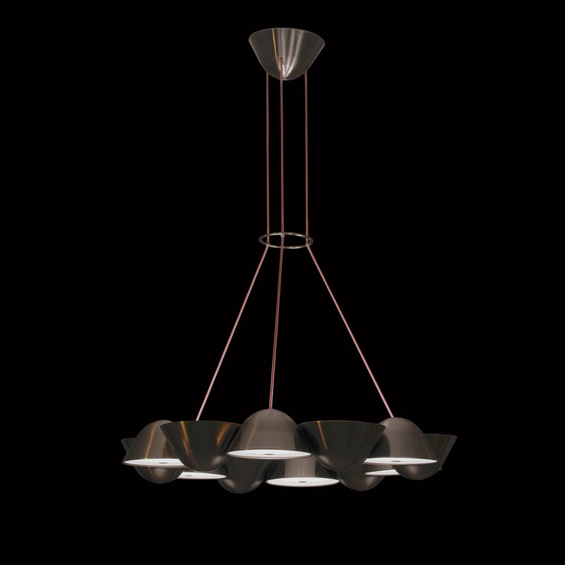 Lobmeyrs The Knight 12 is a smart chandelier with a sleek black metallic finish, featuring modular LED lighting. Six shades are arranged in a circular pattern, suspended by thin rods against the black backdrop.