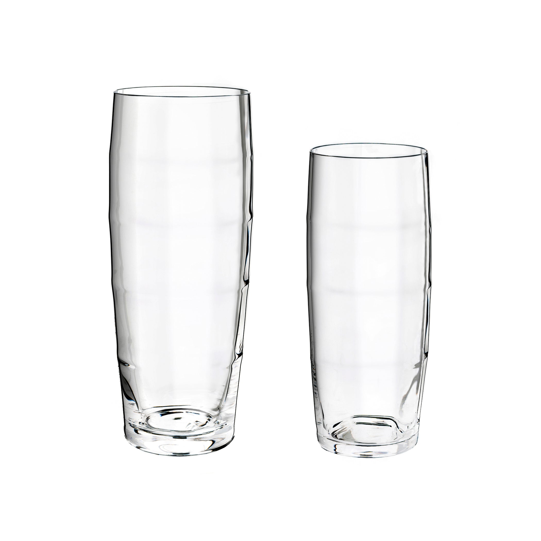 Two Wiener Stutzen tumblers by Lobmeyr, made of mouth-blown lead-free crystal, stand against a white backdrop. The taller one is on the left, while the shorter optic beer tumbler is on the right. Both embody a sleek and minimalistic design.
