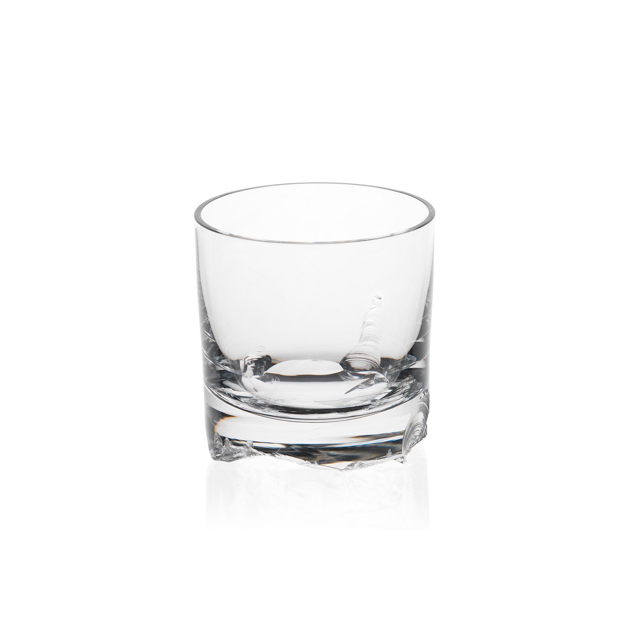 The Bar Series - Flint tumbler by Lobmeyr features a clear, short design and thick base, elegantly reflecting the timeless aesthetic characteristic of Michael Anastassiades work against a plain white background.