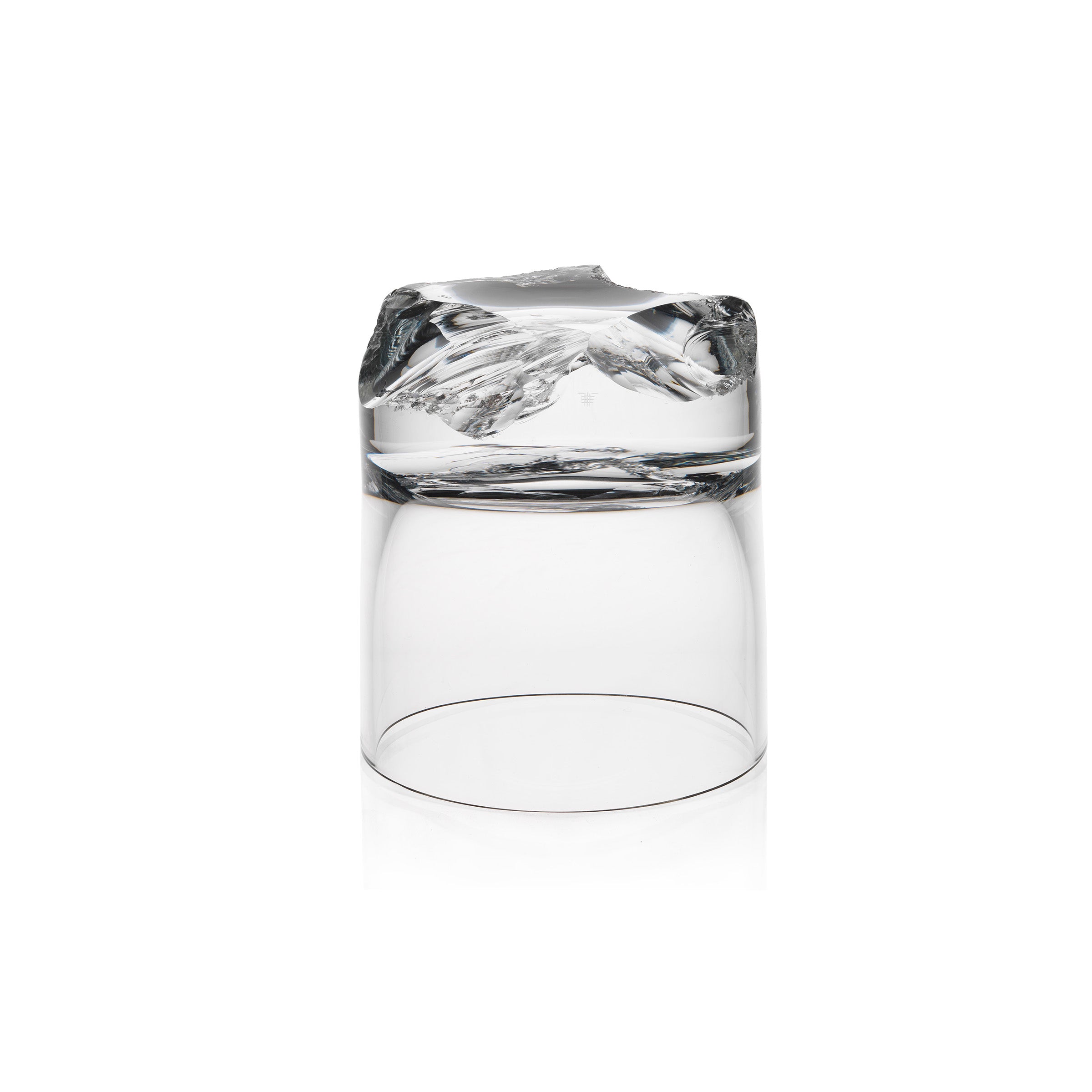 The Bar Series - Flint tumbler by Lobmeyr, designed by Michael Anastassiades, features a transparent glass design with a base resembling an inverted mountain landscape, making it a unique and captivating masterpiece.