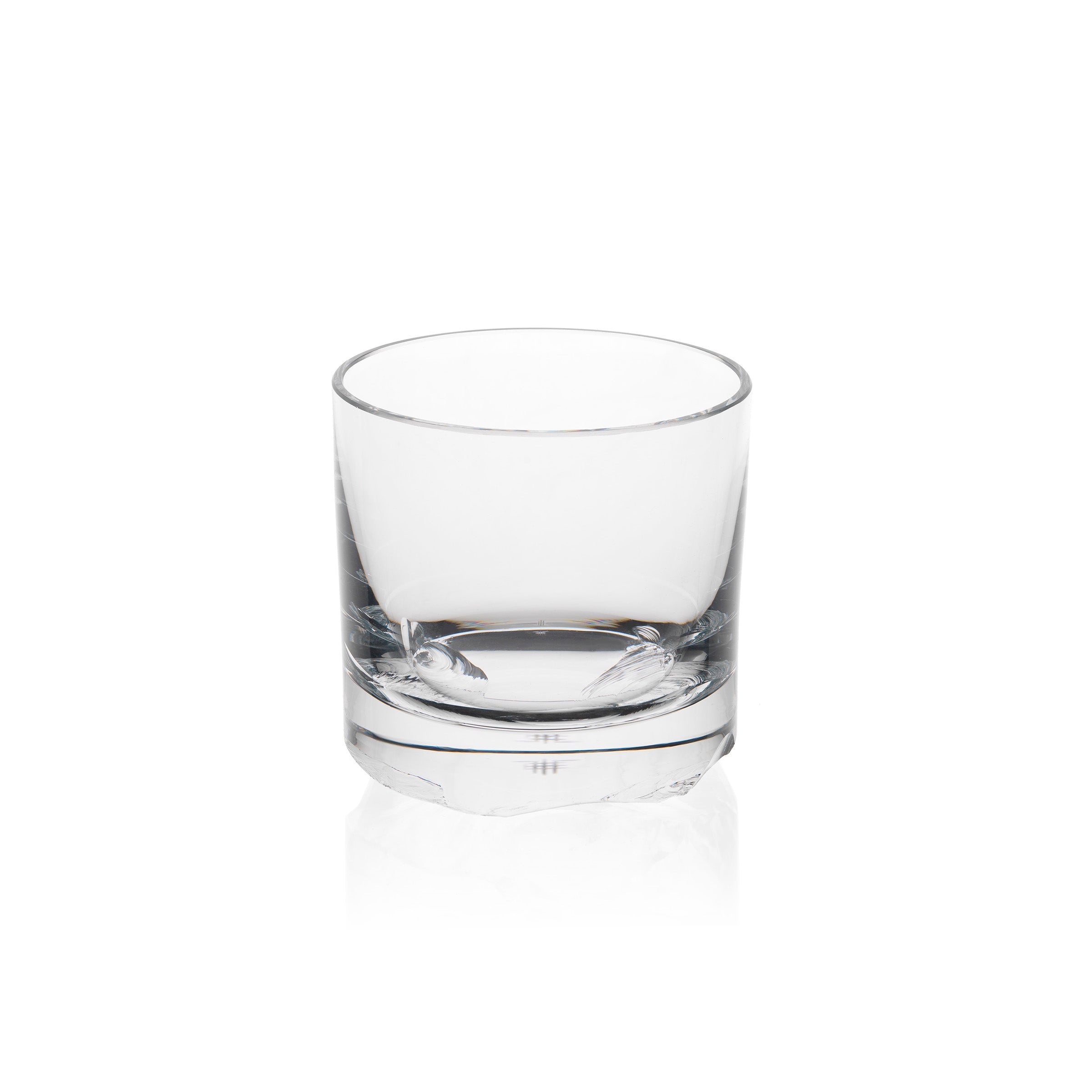 A Lobmeyr Bar Series - Flint glass tumbler with a thick base sits against a plain white background, reflecting Michael Anastassiades minimalist style.
