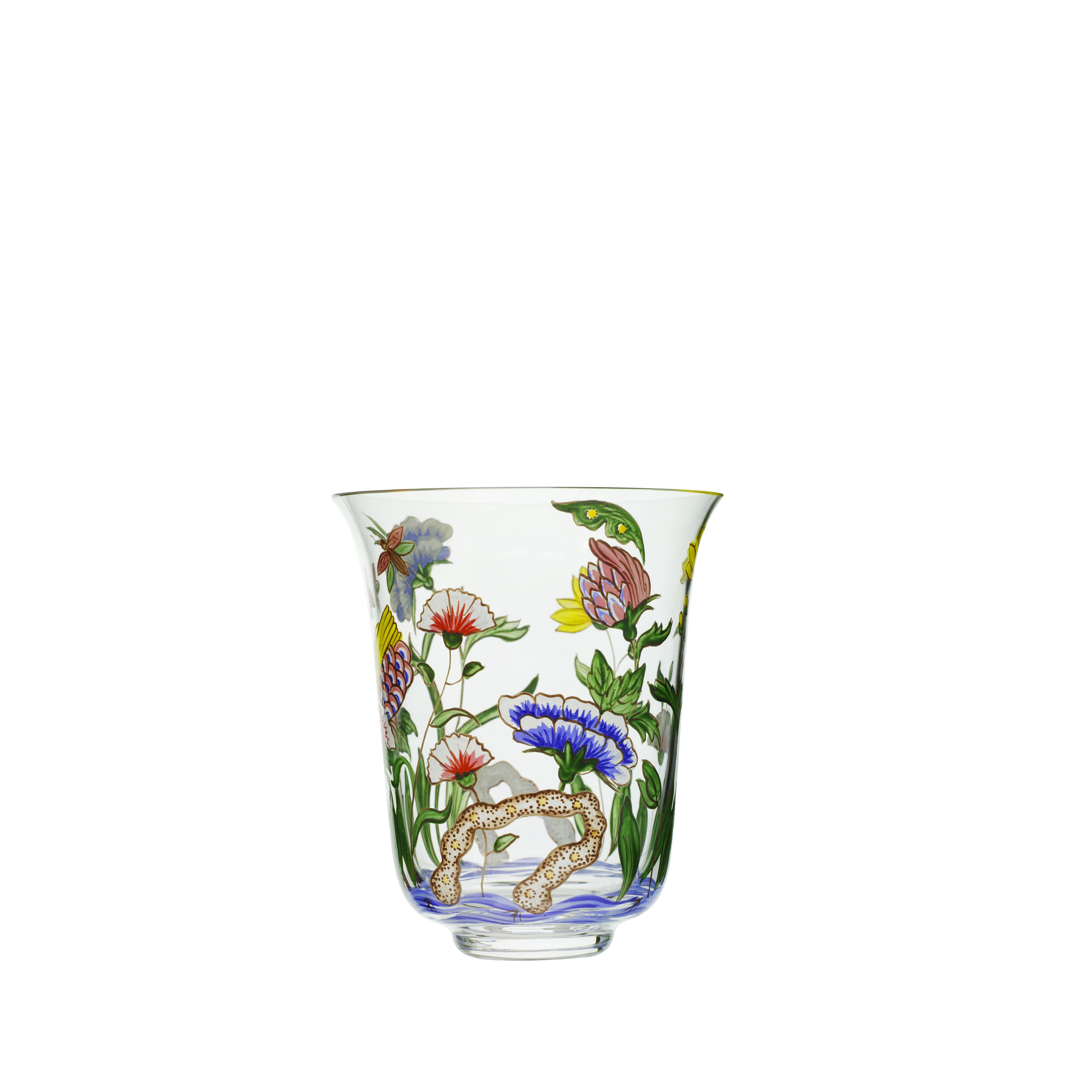 The Oriental Flower Tumbler by Lobmeyr features vibrant oriental ornamentation with intricate floral designs and a snake entwined around a branch. The flowers in red, blue, and green enhance its charm, while the wide, flared top reflects Lobmeyrs elegance.
