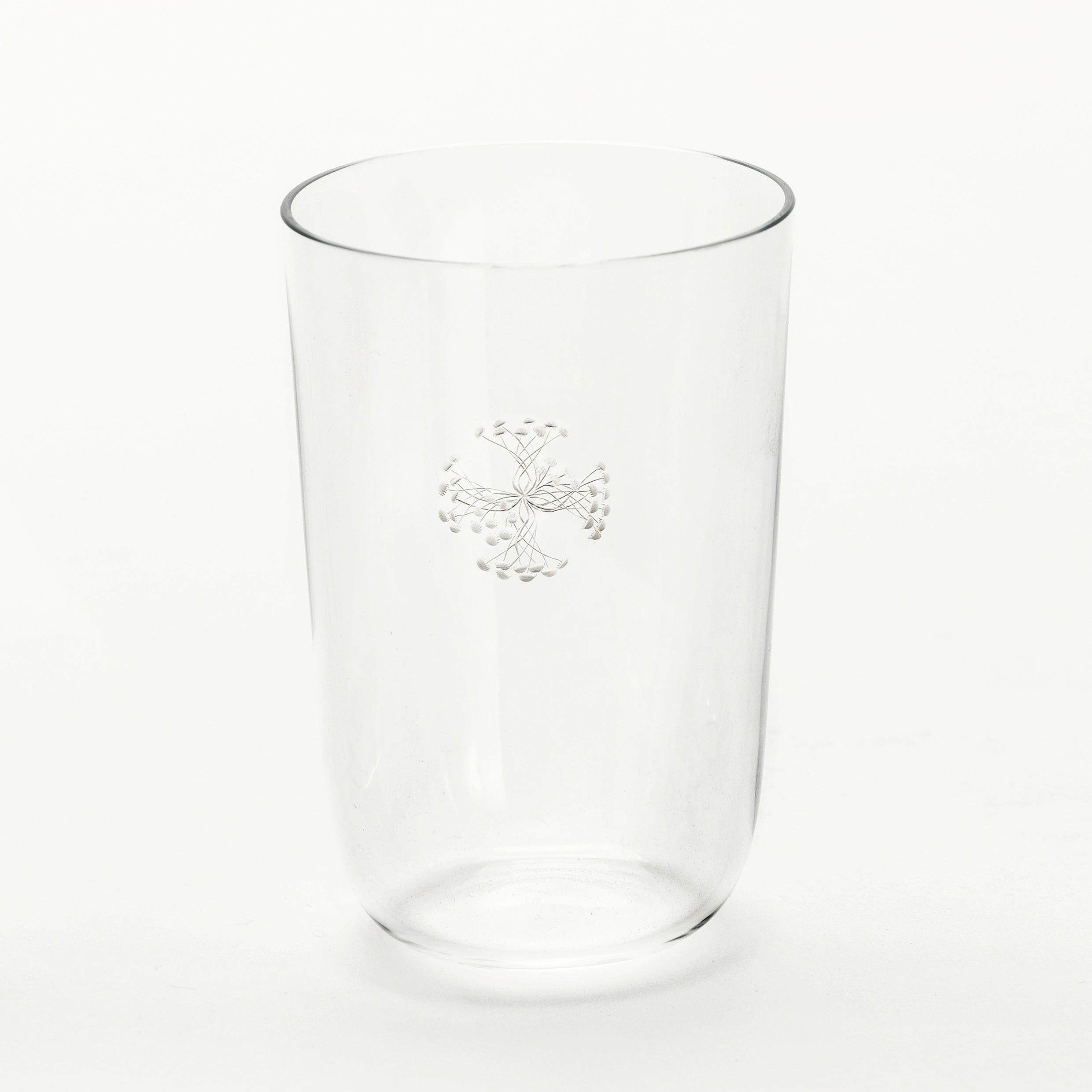 The Still Series by Lobmeyr is a clear crystal vessel featuring a subtle flower-like pattern with delicate lines and small circles in a symmetrical motif, elegantly standing on a plain white background.