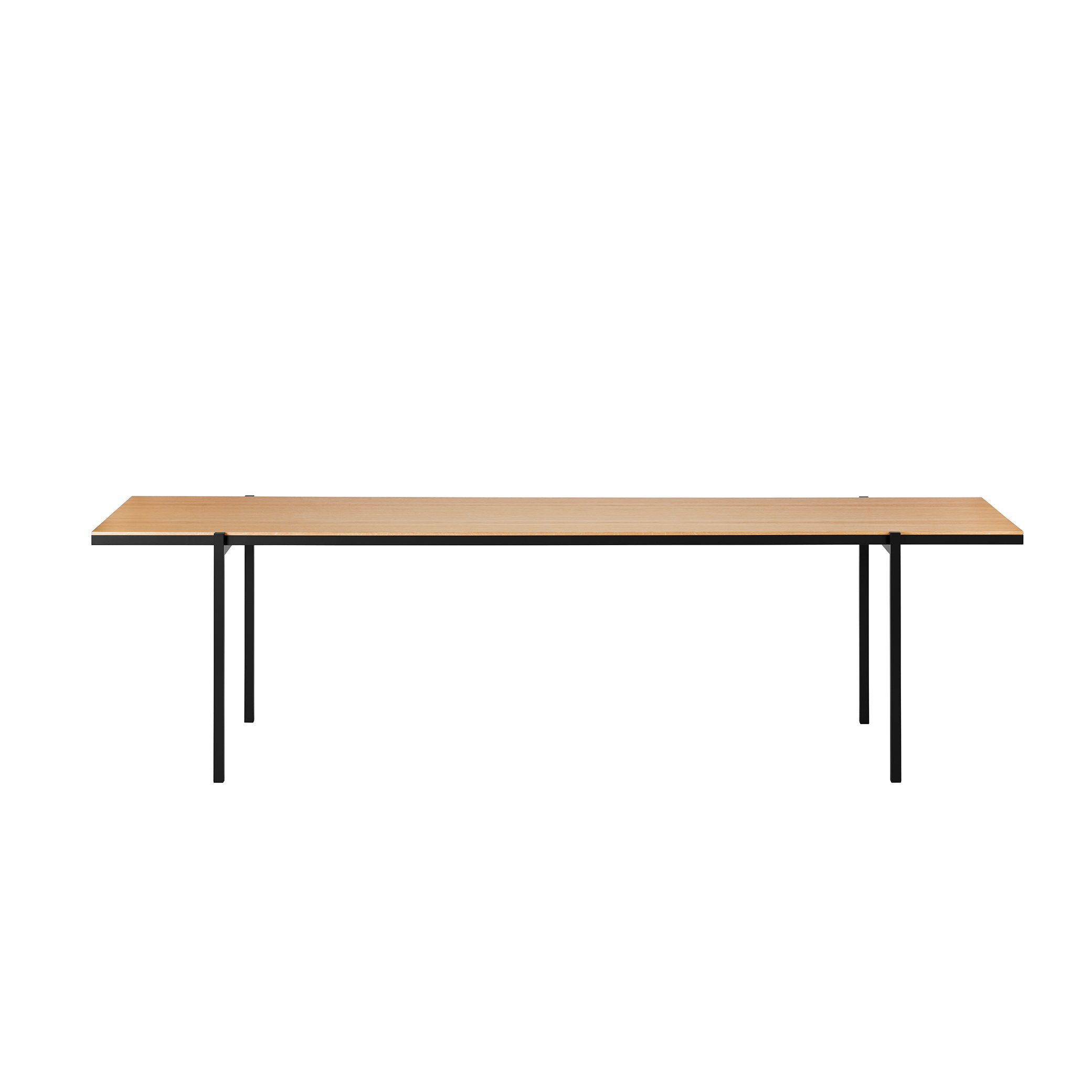 The DL5 Neo Table by Loehr is a minimalist piece, featuring a light wood surface and sleek black steel tube legs, presented against a plain white backdrop.