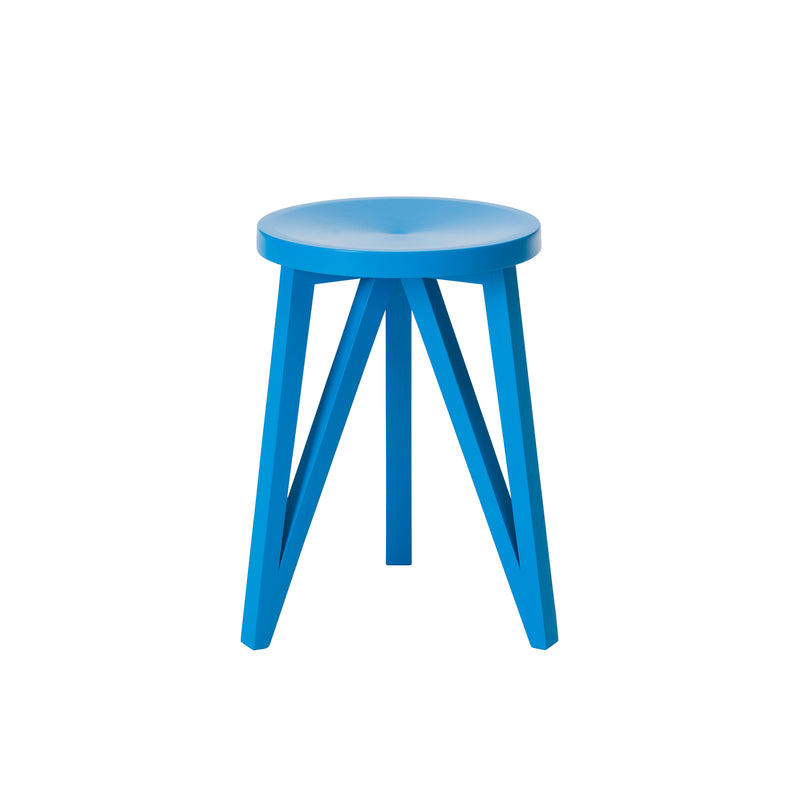 The JL1 Faber Stool by Loehr is northern European-inspired with a bright blue round seat and three angled solid oak legs that converge at the base, displayed against a white backdrop.