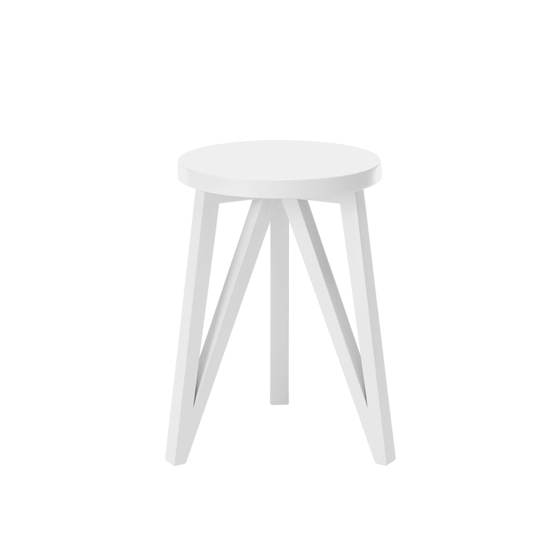 The JL1 Faber Stool by Loehr, a white wooden piece from the FABER collection, features a round seat with three triangular legs. This solid oak stool reflects minimalist northern European design and is set against a white background, highlighting its modern elegance.