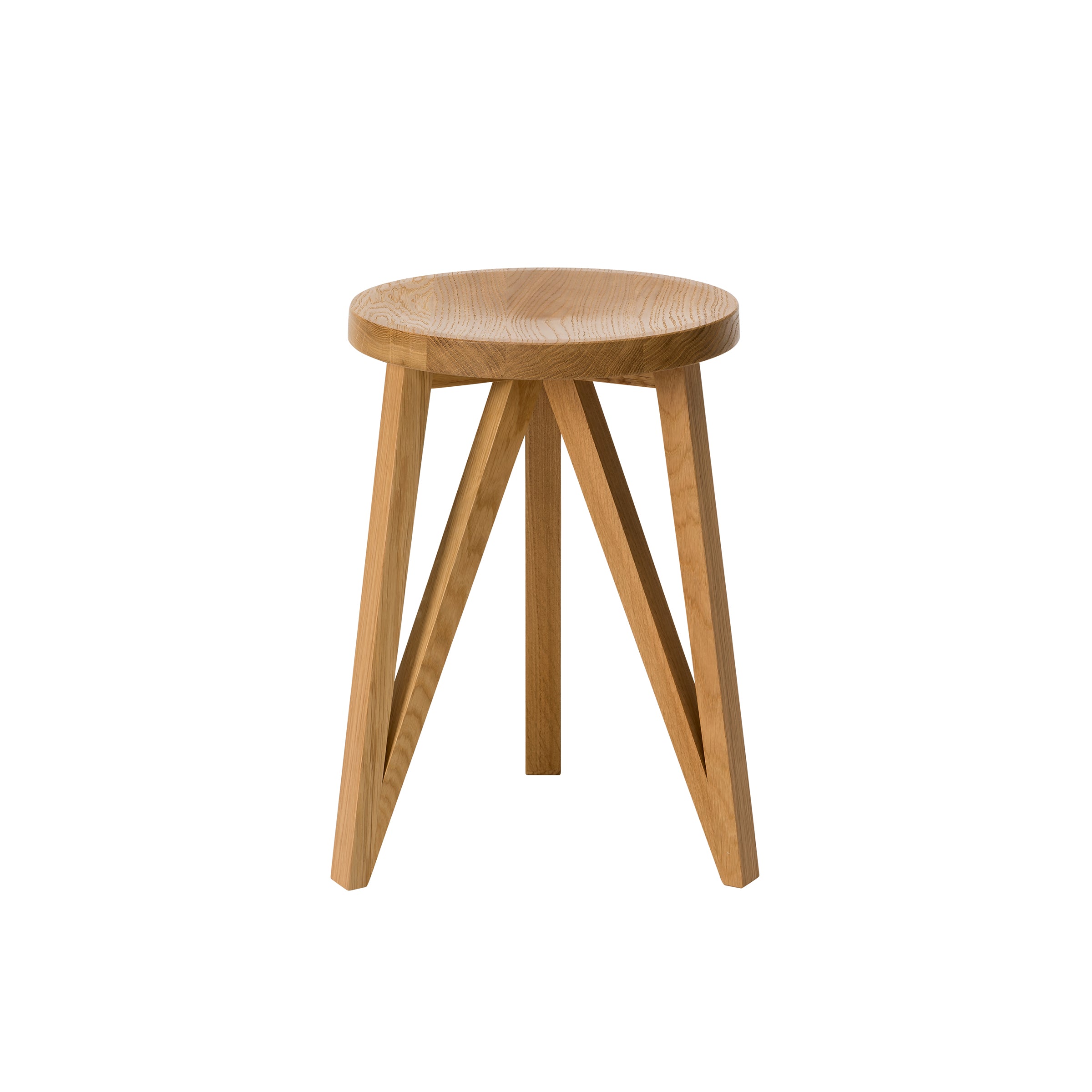The JL1 Faber Stool by Loehr is a minimalist piece with a round, smooth top and four angled legs, showcasing northern European design. Crafted from solid oak, its natural finish emphasizes the rich grain, making it a standout in the FABER collection.