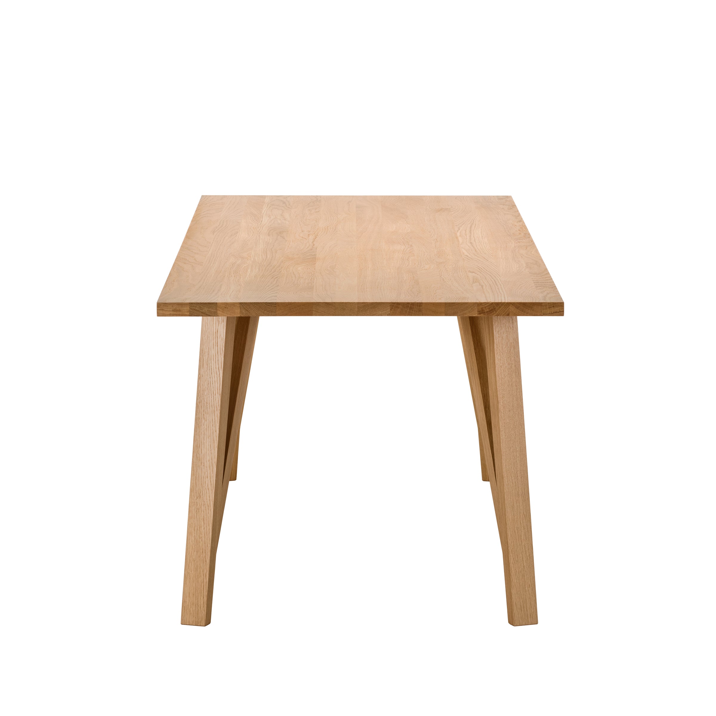 The JL5 Sabeth Table by Loehr is crafted with precision, featuring a rectangular wooden top and four slanted legs. Its light, natural finish echoes European half-timbered architecture, exuding timeless charm and exquisite craftsmanship when viewed from its narrow side.