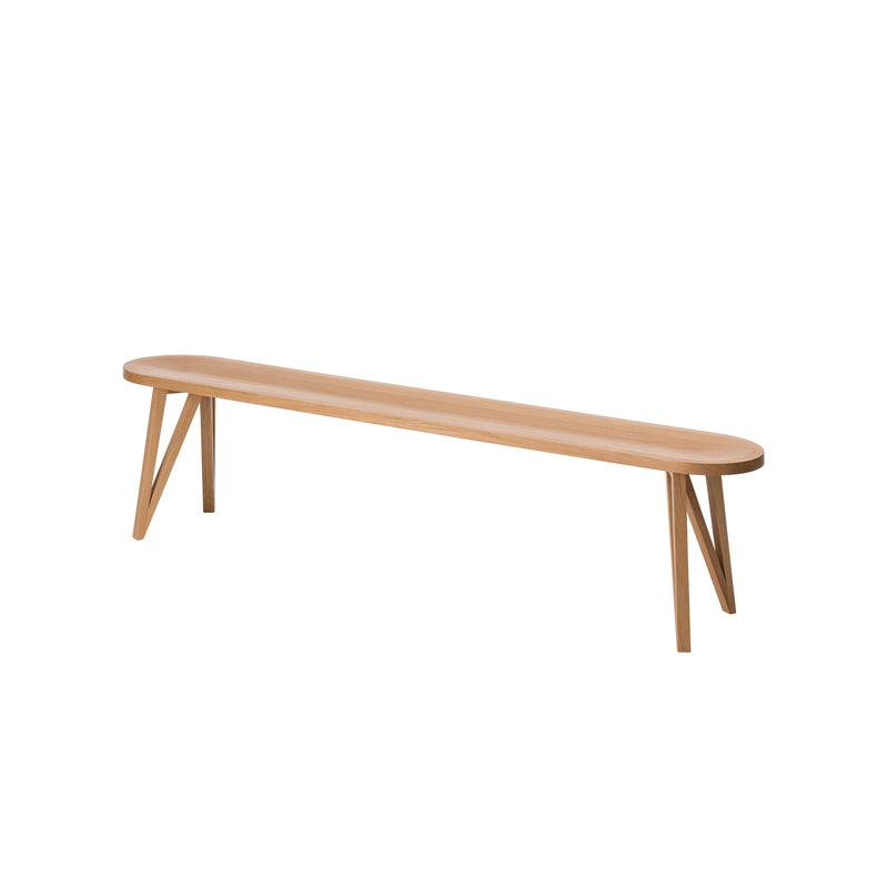 The JL8 Faber Bench by Loehr is a solid oak, minimalist piece with a light wood finish and angled legs, highlighting northern European design against a plain white background.