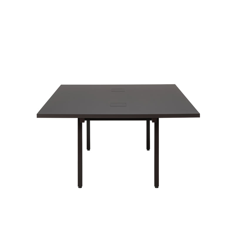 The L2 Eno Worktable by Loehr is a sleek, minimalist black desk featuring a rectangular top and four straight legs. Its designed as a hybrid workstation with two centrally positioned square cutouts for cable management.