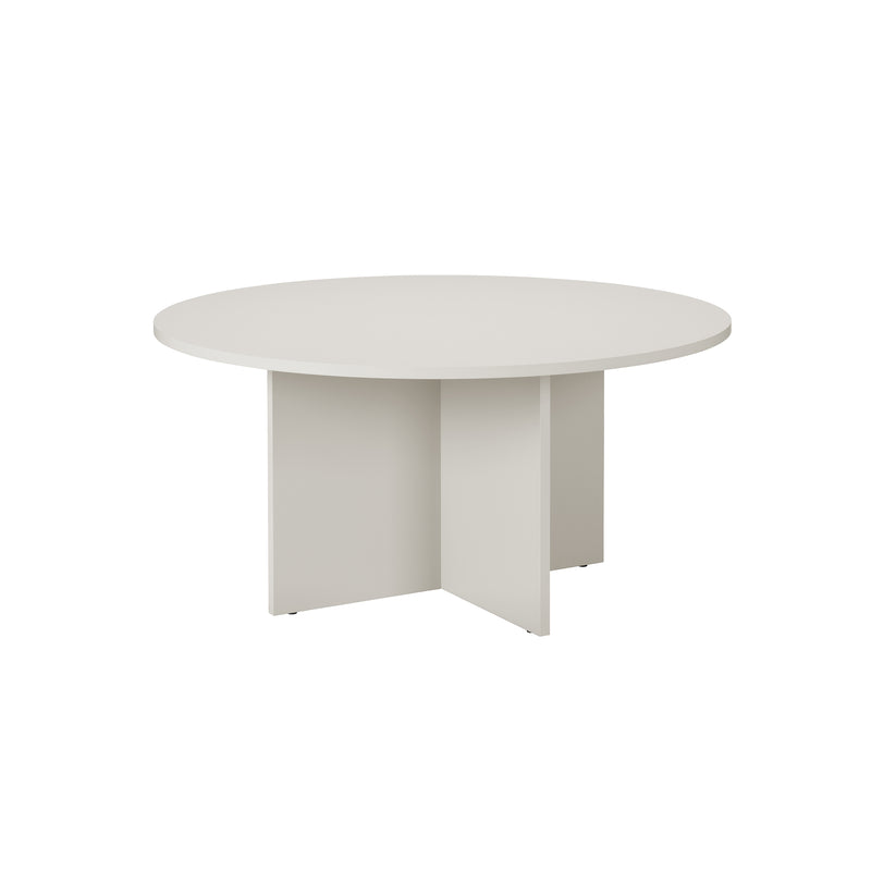 The L4 BASIL TABLE by Loehr is a modern, round table with a cross-shaped base and sculptural appearance. Set against a plain white background, it features sleek lines and minimalist design crafted from coated fiberboard.