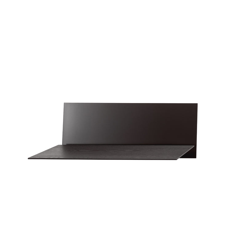 The S1 CHAPTER Bureau by Loehr is a minimalist black shelf featuring a fold-up tabletop and tall vertical back panel. This sleek, modern piece fits perfectly in contemporary interiors, functioning well when wall-mounted against a plain white background.