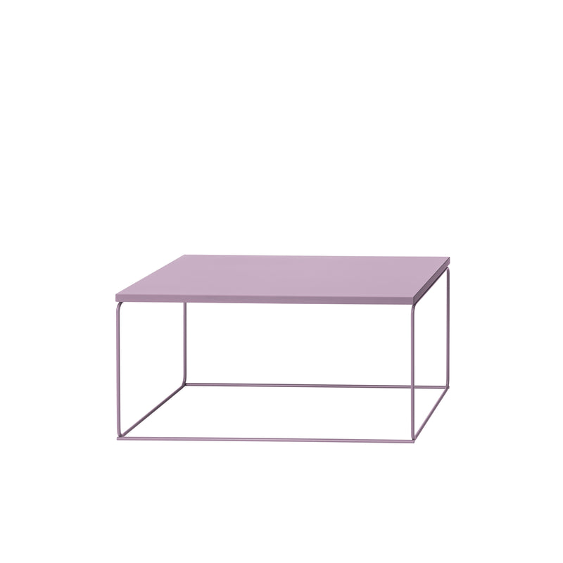 The DL1 Tangram Side Table Rectangular by Loehr features a minimalist design with a flat purple top and slender metal legs forming a geometric frame. Its sleek, modern aesthetic emphasizes simplicity and functionality, making it a striking addition to any architectural space.