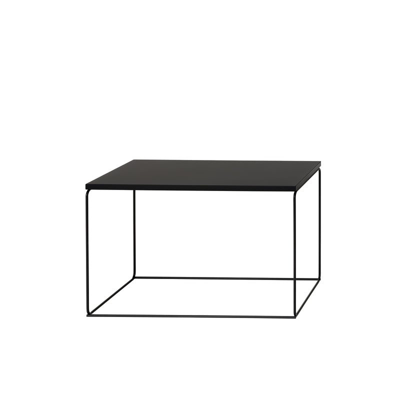 Introducing the Loehr DL1 Tangram Side Table Rectangular, a minimalist black coffee table that perfectly blends modern design and functionality. Its slender metal frame and rectangular top offer a sleek side table option with an airy appearance inspired by architectural landscapes.